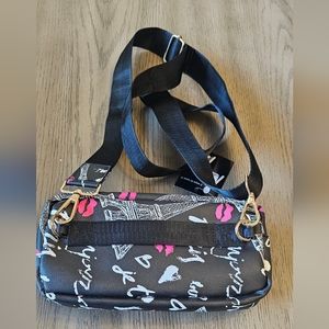 Black nylon graffiti crossbody and pouch bag.